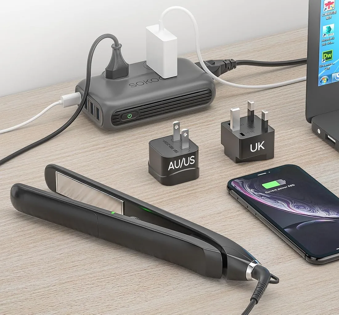 SOKOO converter on a desk powering a hair straightener, a phone and a laptop